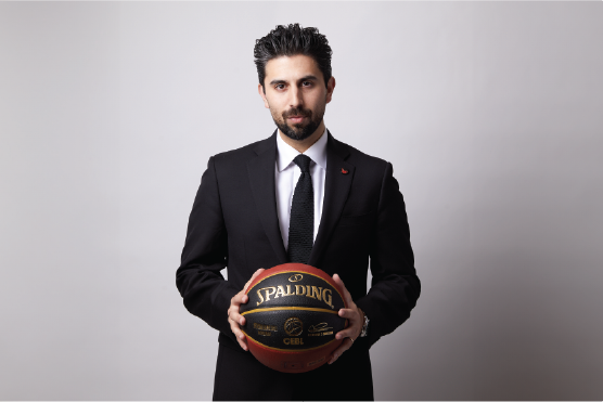 Man in suiting holding basketball