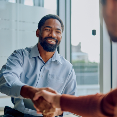 Person shaking hands and smiling